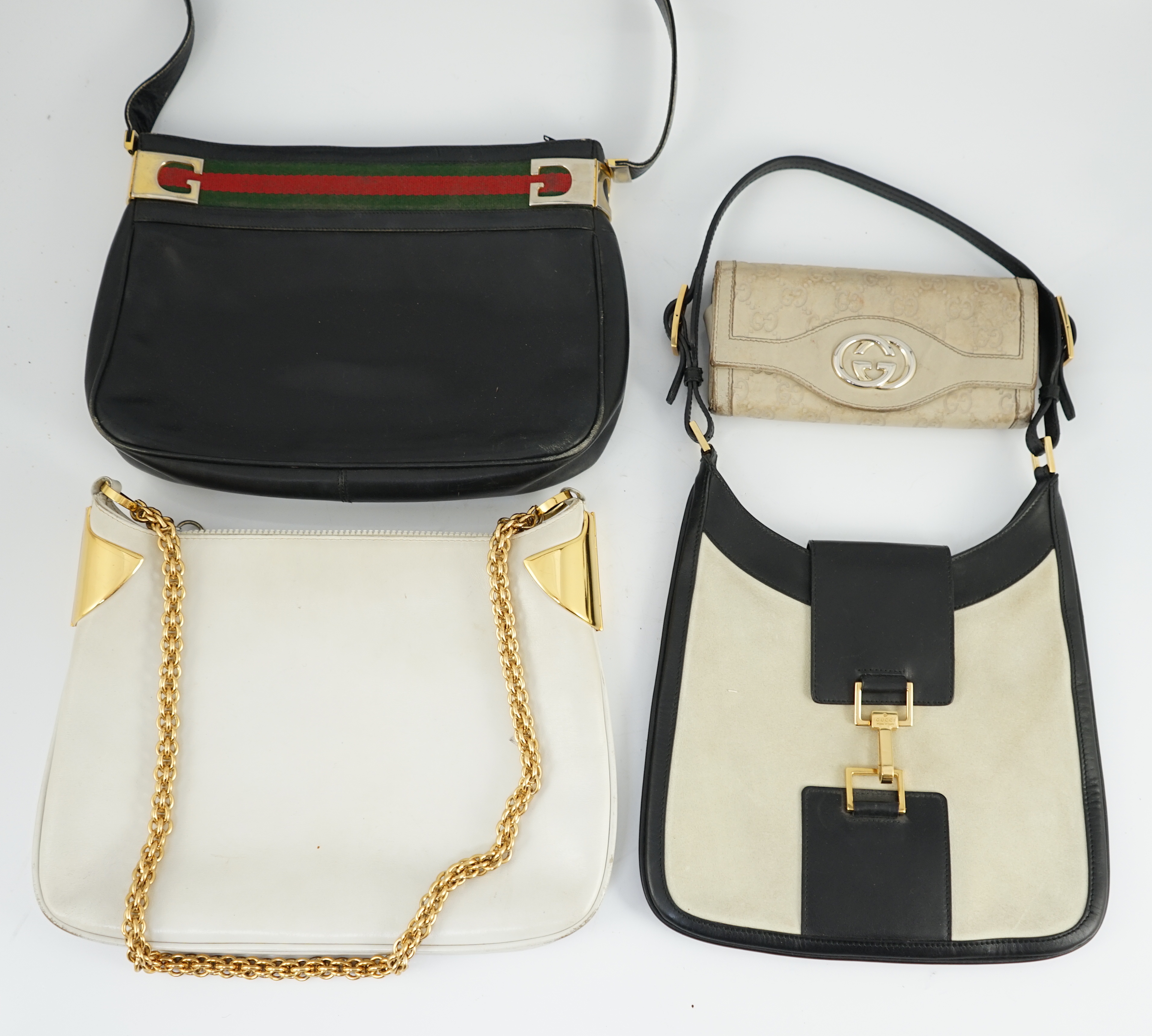 Three vintage Gucci hand bags and clutch wallet